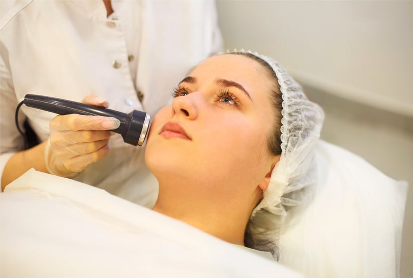 Crop Beautician Using Machine for Radiofrequency Lifting