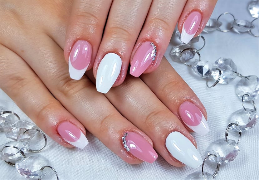 Professional manicure with gel nails painted